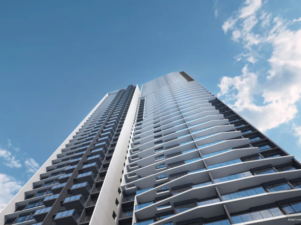 The_Orie_External_2 — A tall building stands against a clear blue sky in The Orie